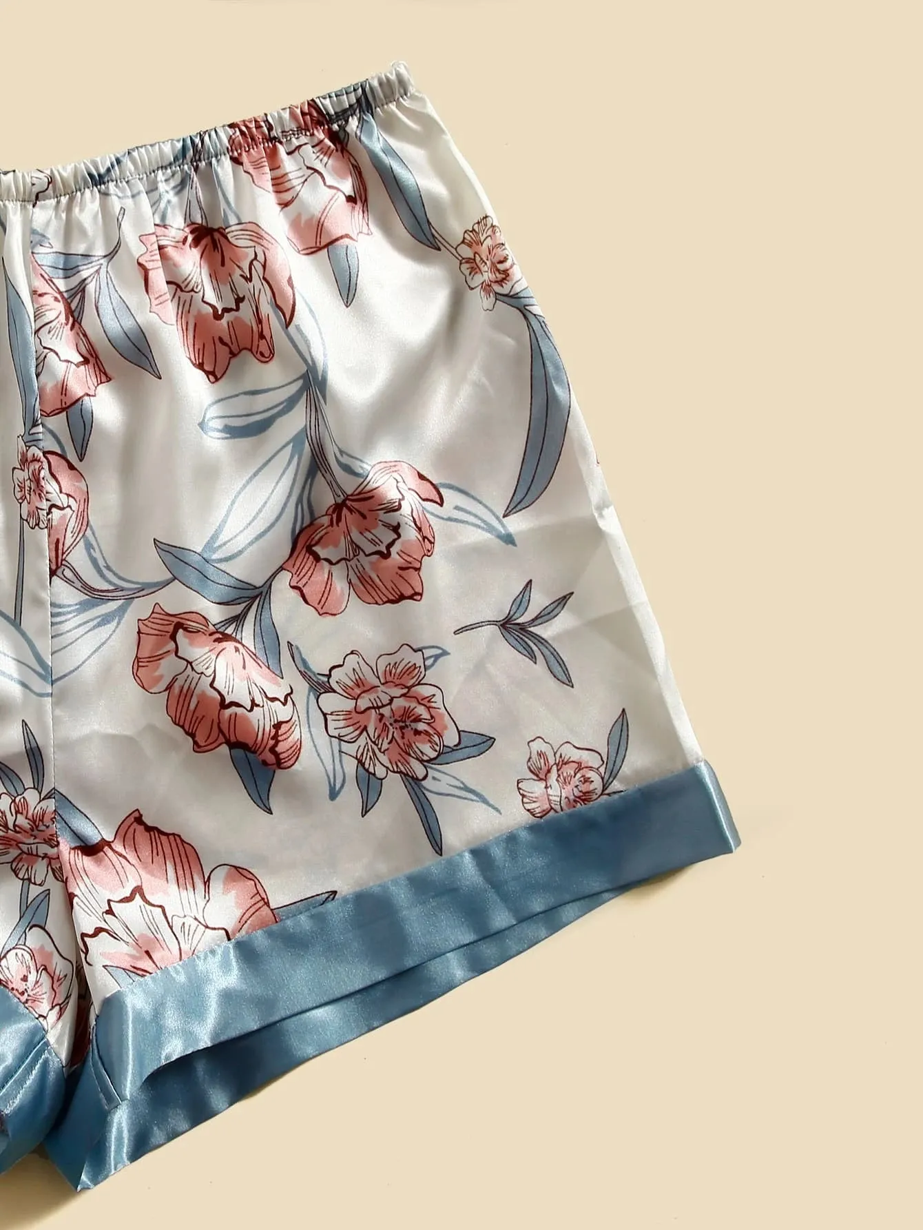 "Get cozy in this 5-piece floral print satin set! 🌸✨ #SatinRobe #CamiTop #NightDress #Pants #Shorts"